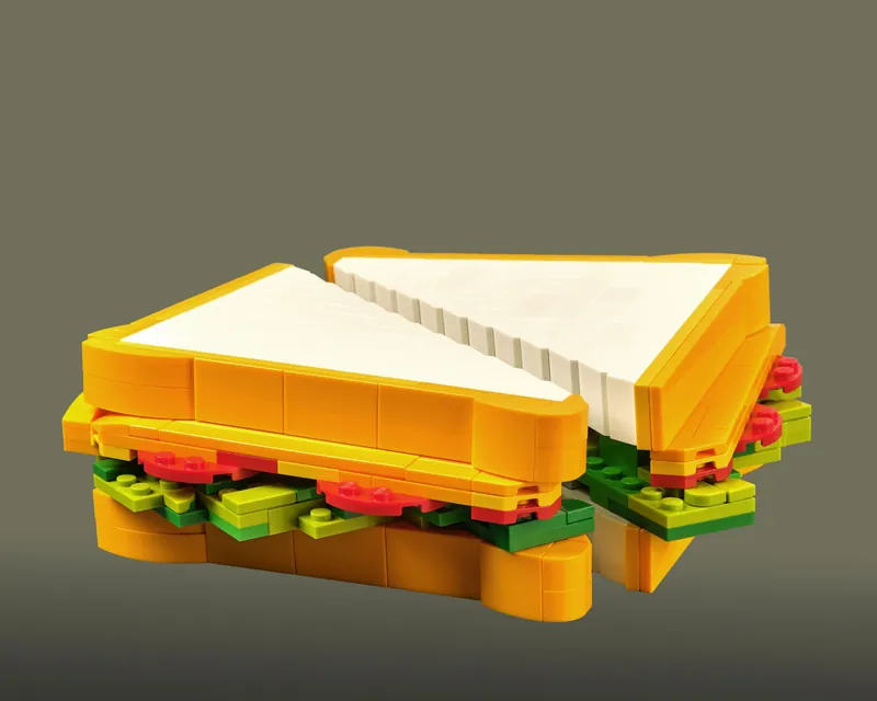 Sandwich LEGO su fondale verde salvia